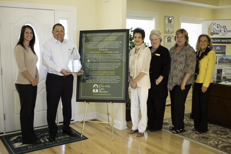 Country Life Homes received the Builder of Integrity Award for the second consecutive year. Shown are (l-r) Amanda Fram, business development manager, Quality Builders Warranty Corp.; Michael Fannin, president, Country Life Homes; Gwen Greenly, new homes sales manager, Country Life Homes; Nancy Groom, new homes sales manager, Country Life Homes; Robin Bunting, new homes sales manager, Country Life Homes; and Elaine Taylor, marketing specialist, Country Life Homes. SOURCE SUBMITTED